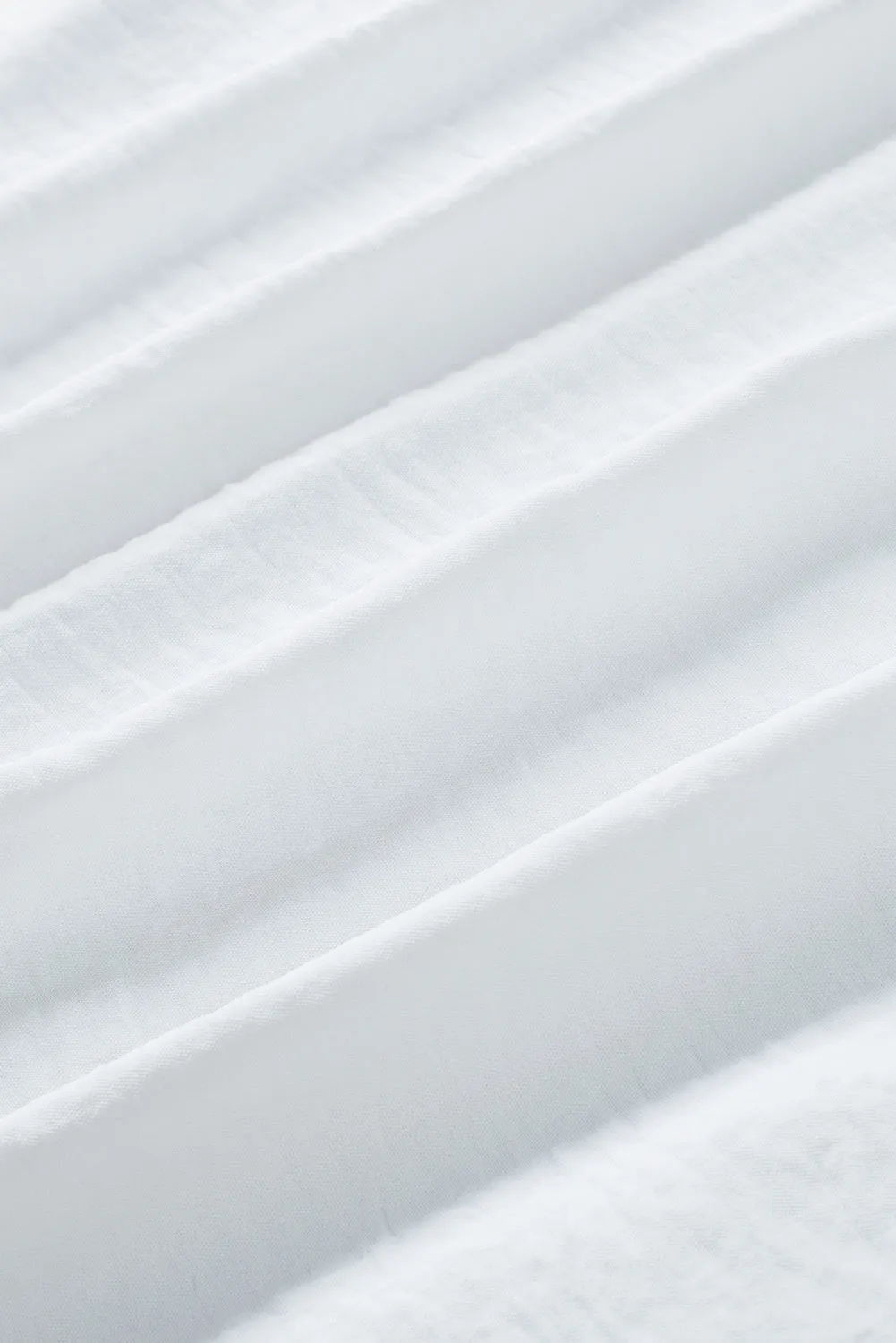 White Smocked Wrist Shift Top